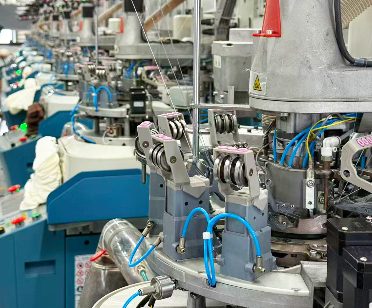 FCSOX sock manufacturing facility with precision knitting machines